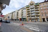 a street in a city with a building at Apartment Wroclaw Jedności Narodowej by Noclegi Renters in Wrocław