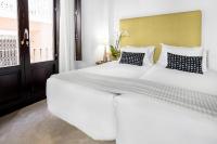 Postel nebo postele na pokoji v ubytování Suites Campo del Príncipe