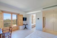 Postel nebo postele na pokoji v ubytování Mansion Bahia