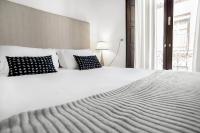 Postel nebo postele na pokoji v ubytování Suites Campo del Príncipe