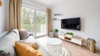 Televízia a/alebo spoločenská miestnosť v ubytovaní Apartamenty Sun & Snow Let's Sea Baltic Park