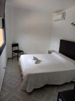 Postel nebo postele na pokoji v ubytování Hotel l'Albera