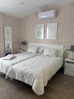 Łóżko lub łóżka w pokoju w obiekcie Niebla Centro Apartamentos