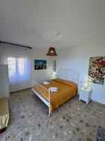 A bed or beds in a room at Il Vicolo Palinuro