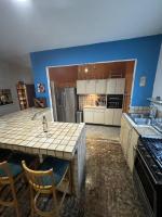 a kitchen with a large island in a room at Lower Price, More Style, Discount Studio In San Juan,Pr, Beach, Free Bikes in San Juan
