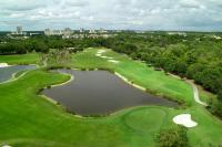 an aerial view of a golf course with a pond at Orlando World Center Marriott in Orlando