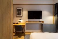 Televízia a/alebo spoločenská miestnosť v ubytovaní Radisson Hotel & Suites, Gdansk, Wyspa Spichrzów