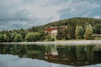 a house on the shore of a lake at Hotel Partizán in Tale