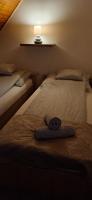 Posteľ alebo postele v izbe v ubytovaní For You Apartman Gyula