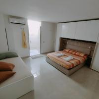 Postel nebo postele na pokoji v ubytování Perla delle Maldive