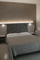Posteľ alebo postele v izbe v ubytovaní Gabbiano Apartments
