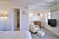 Posteľ alebo postele v izbe v ubytovaní Manu Mykonos Next to the Beach Quality Brand Villa & Bungalows