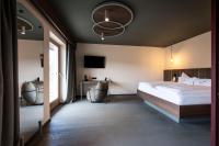 A bed or beds in a room at Hotel Belvedere - Fine Dining, Hideaway & SPA