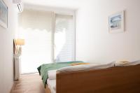 Posteľ alebo postele v izbe v ubytovaní Apartament Słoneczny Gródek 30