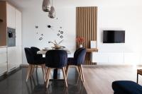 Televízia a/alebo spoločenská miestnosť v ubytovaní Apartament Słoneczny Gródek 30