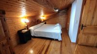 Postel nebo postele na pokoji v ubytování Apartamentos Rurales La Tablá