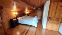Postel nebo postele na pokoji v ubytování Apartamentos Rurales La Tablá