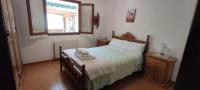 Postel nebo postele na pokoji v ubytování Apartamentos Rurales La Tablá