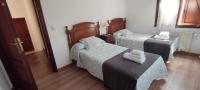 Postel nebo postele na pokoji v ubytování Apartamentos Rurales La Tablá