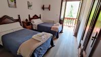 Postel nebo postele na pokoji v ubytování Apartamentos Rurales La Tablá