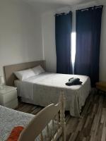 Postel nebo postele na pokoji v ubytování Villa pilonga