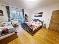A bed or beds in a room at HomeW4 - Rosen Apartment