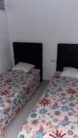 Posteľ alebo postele v izbe v ubytovaní Apartamentos Tierra de Irta 3000