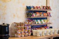a shelf filled with lots of different types of food at เลอดอย Le Doi in Ban Huai Khai