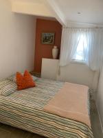 Ein Bett oder Betten in einem Zimmer der Unterkunft Le Petit Chene