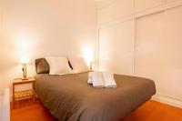 A bed or beds in a room at T1· Family Getaway 50m from the Beach