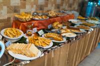 a buffet line with various types of food on plates at SEL Nibash Hotel & Serviced Apartments in Dhaka