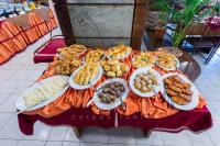 a table with plates of food on top of it at SEL Nibash Hotel & Serviced Apartments in Dhaka