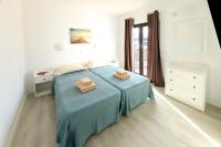 Łóżko lub łóżka w pokoju w obiekcie Salmarina Bungalows