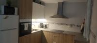 Kuchyň nebo kuchyňský kout v ubytování Apartament MaxMax