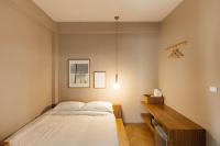Postel nebo postele na pokoji v ubytování Maplewood Hotel Chiangmai