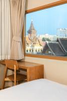Postel nebo postele na pokoji v ubytování Maplewood Hotel Chiangmai