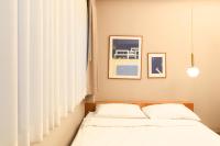 Postel nebo postele na pokoji v ubytování Maplewood Hotel Chiangmai