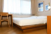 Postel nebo postele na pokoji v ubytování Maplewood Hotel Chiangmai