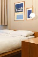 Postel nebo postele na pokoji v ubytování Maplewood Hotel Chiangmai