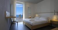 A bed or beds in a room at Hotel Due Gemelli