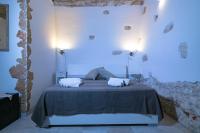 Łóżko lub łóżka w pokoju w obiekcie Casa Gioia Ostuni