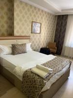 Postel nebo postele na pokoji v ubytování Dimet Park Hotel