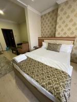 Postel nebo postele na pokoji v ubytování Dimet Park Hotel