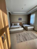 Postel nebo postele na pokoji v ubytování Dimet Park Hotel