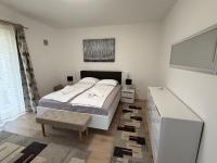 Posteľ alebo postele v izbe v ubytovaní Apartments Puntamika