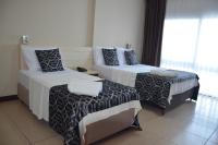 Postel nebo postele na pokoji v ubytování Denizkumu Hotel