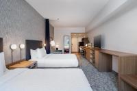 Home2 Suites By Hilton Houston Downtown Convention Centerにあるベッド