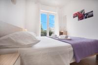 Postel nebo postele na pokoji v ubytování Apartments A&A