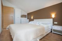 Postel nebo postele na pokoji v ubytování Apartments A&A