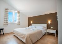 Postel nebo postele na pokoji v ubytování Apartments A&A